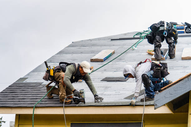 Professional Gutter Installation technician working in Norwell, MA